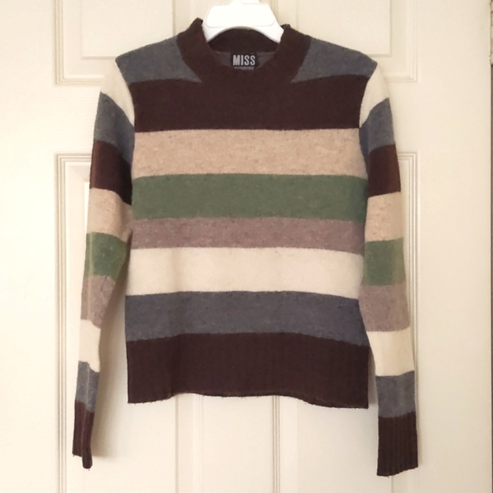Girl's Wool crewneck sweater with multi color stripes.